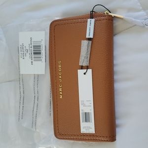Brand new marc jacobs zip around wallet in smoked almond.